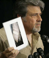 Tom Biscardi shows the press conference a close up of the creatures mouth and tongue